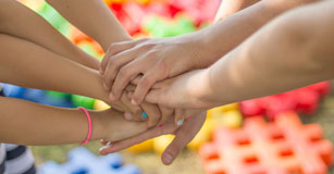 image of student hands together for a go team