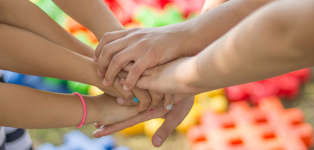 image of student hands together for a go team