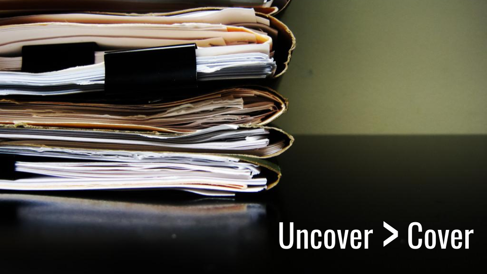 uncover is greater the cover - image of ridiculous stack of paperwork